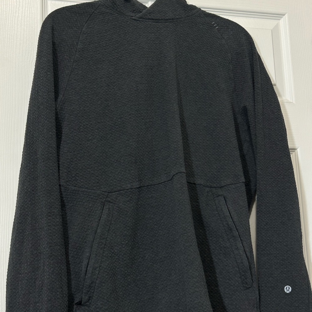 Lululemon Men's At Ease Hoodie in black or charcoal grey.